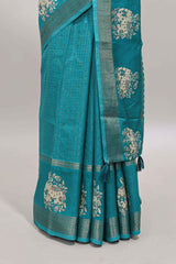 Turquoise green checked elephant motifs dola silk saree with self zari border and striped pallu