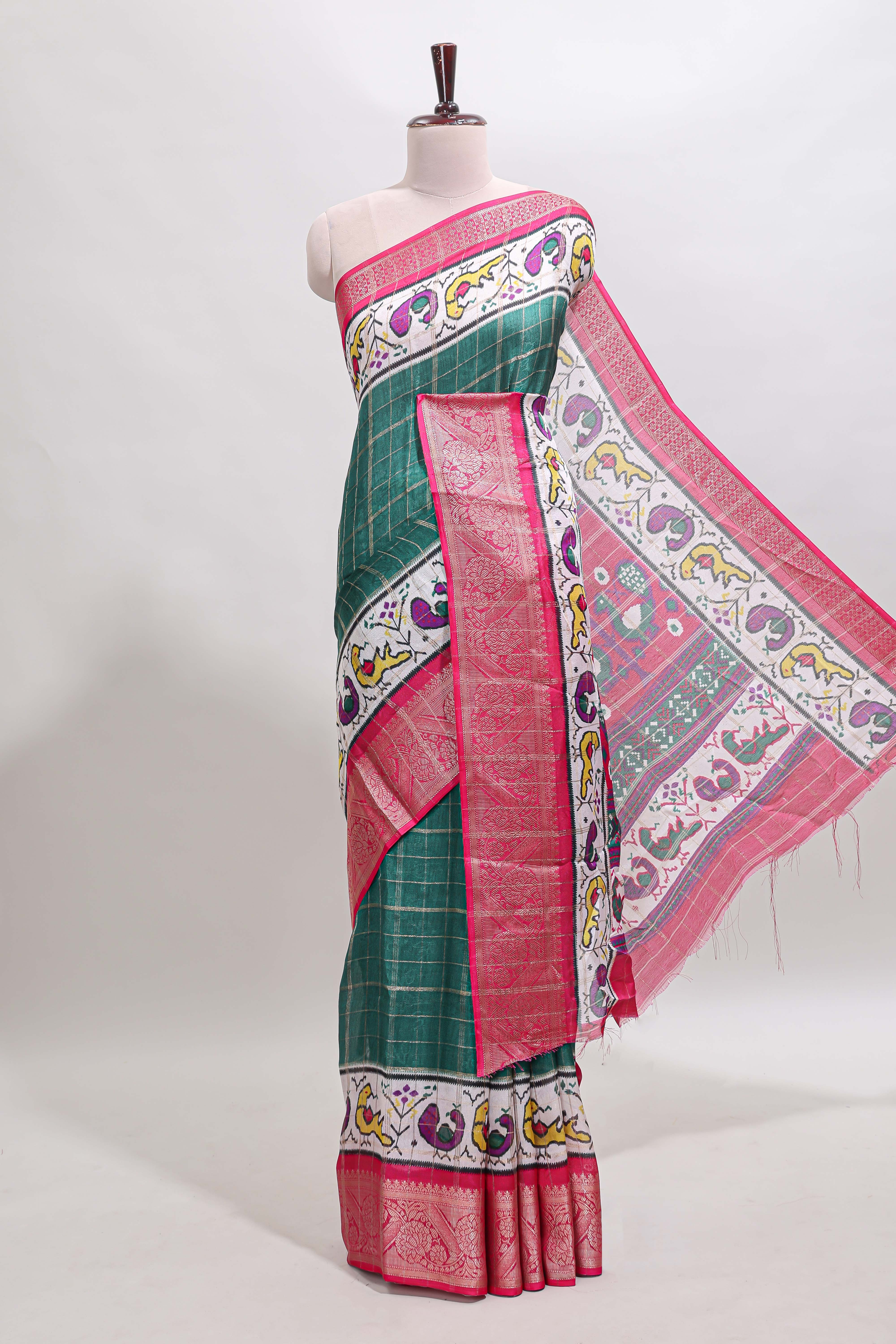 Green checked dola silk saree with contrast zari border and blouse