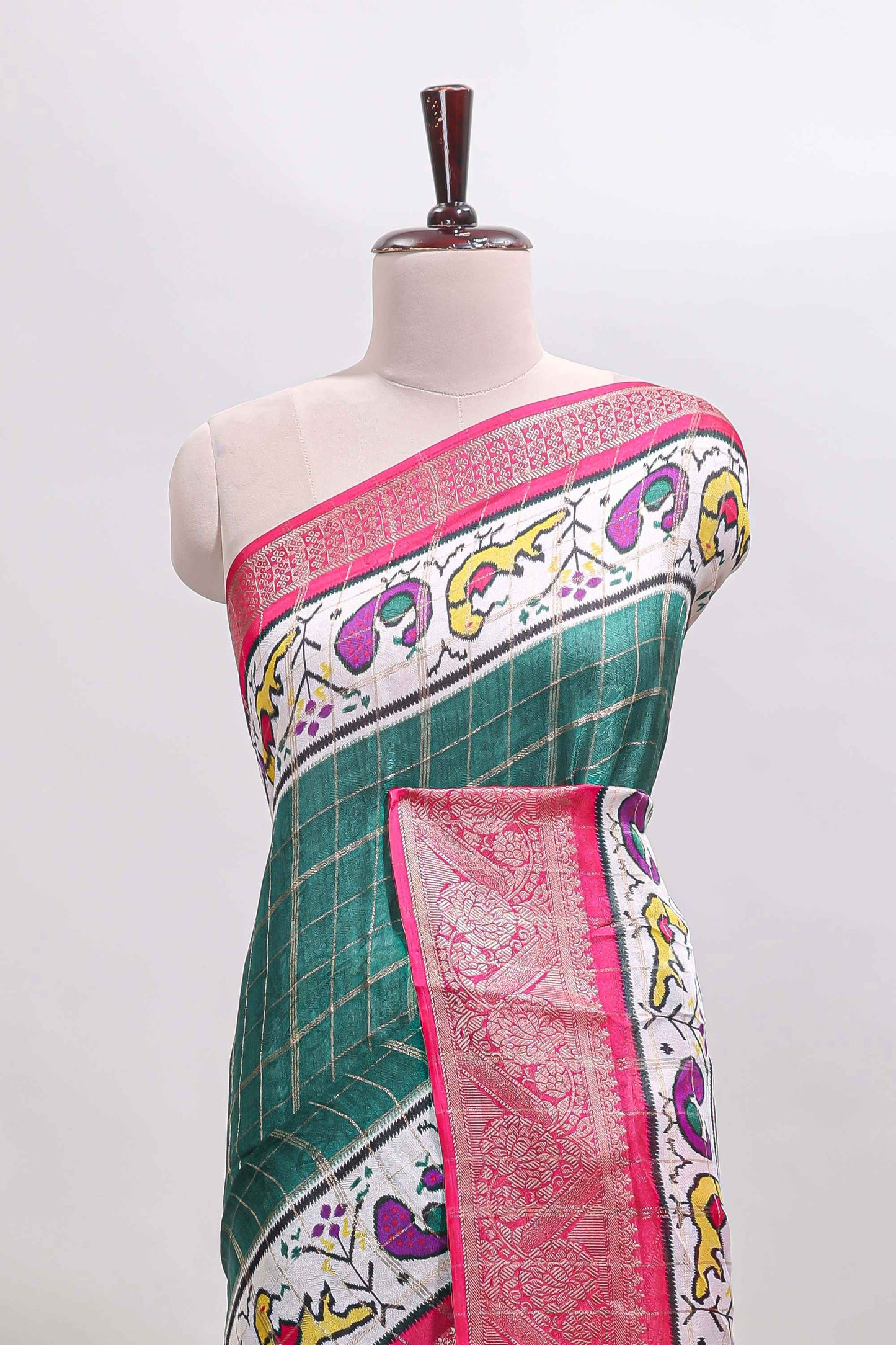 Green checked dola silk saree with contrast zari border and blouse