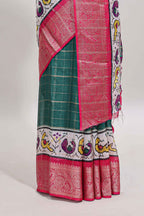 Green checked dola silk saree with contrast zari border and blouse
