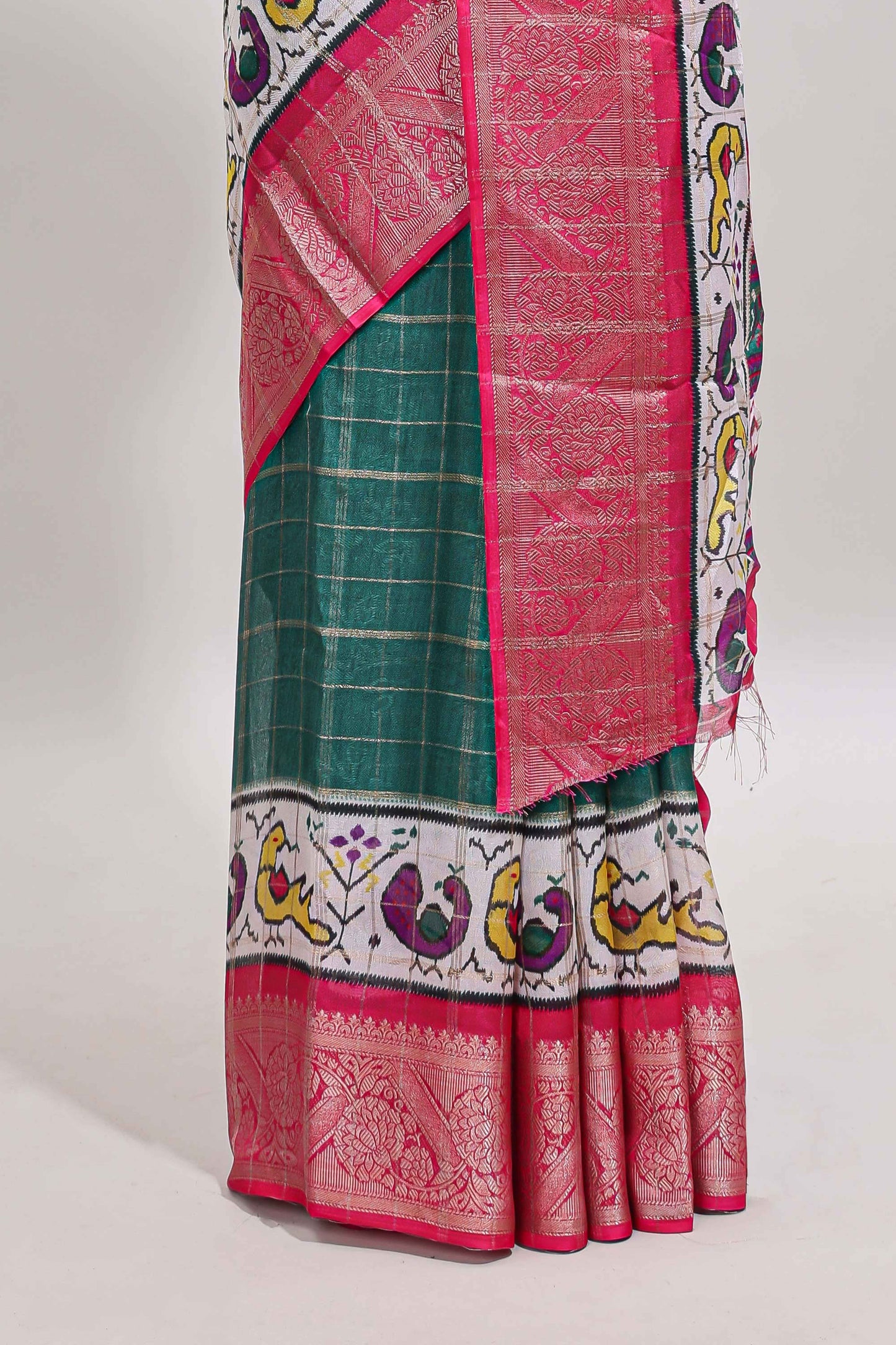 Green checked dola silk saree with contrast zari border and blouse