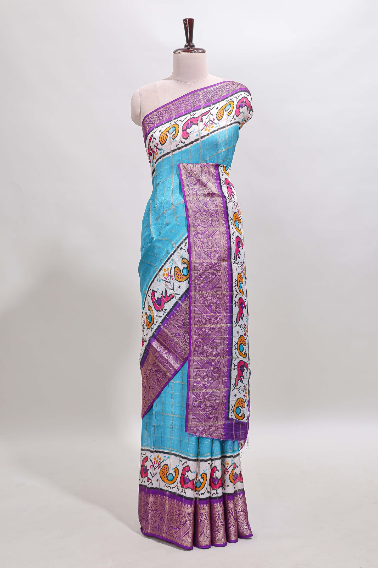 Blue checked dola silk saree with contrast zari border and blouse
