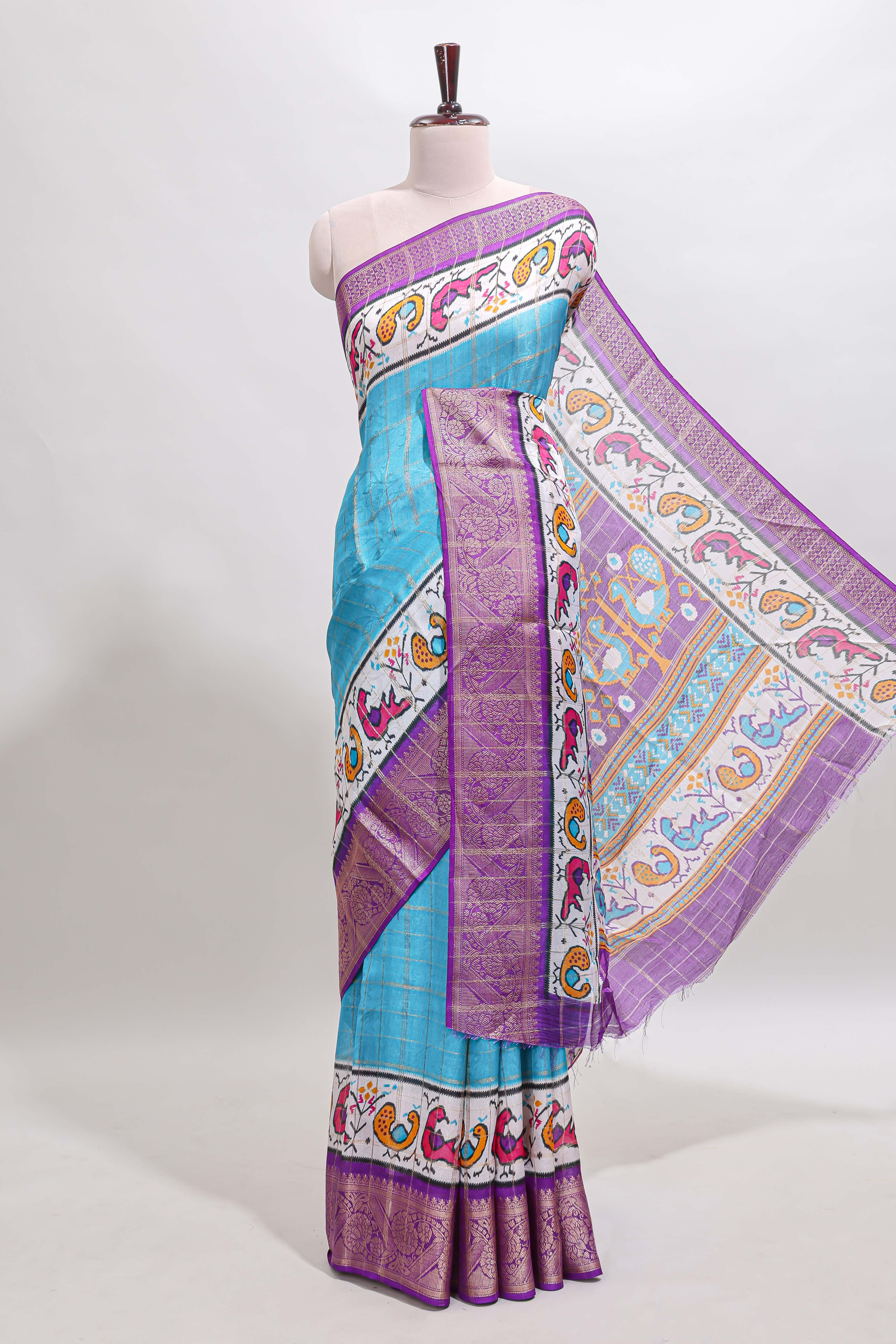 Blue checked dola silk saree with contrast zari border and blouse