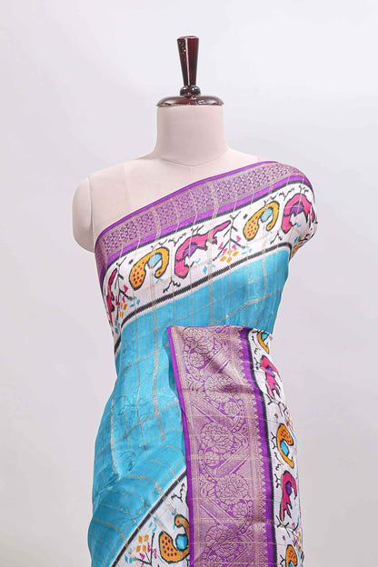 Blue checked dola silk saree with contrast zari border and blouse