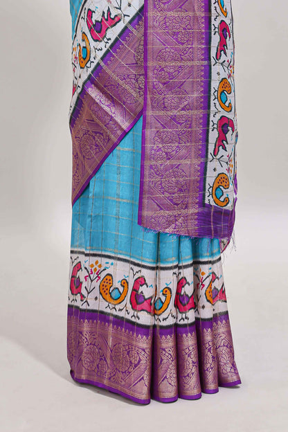 Blue checked dola silk saree with contrast zari border and blouse