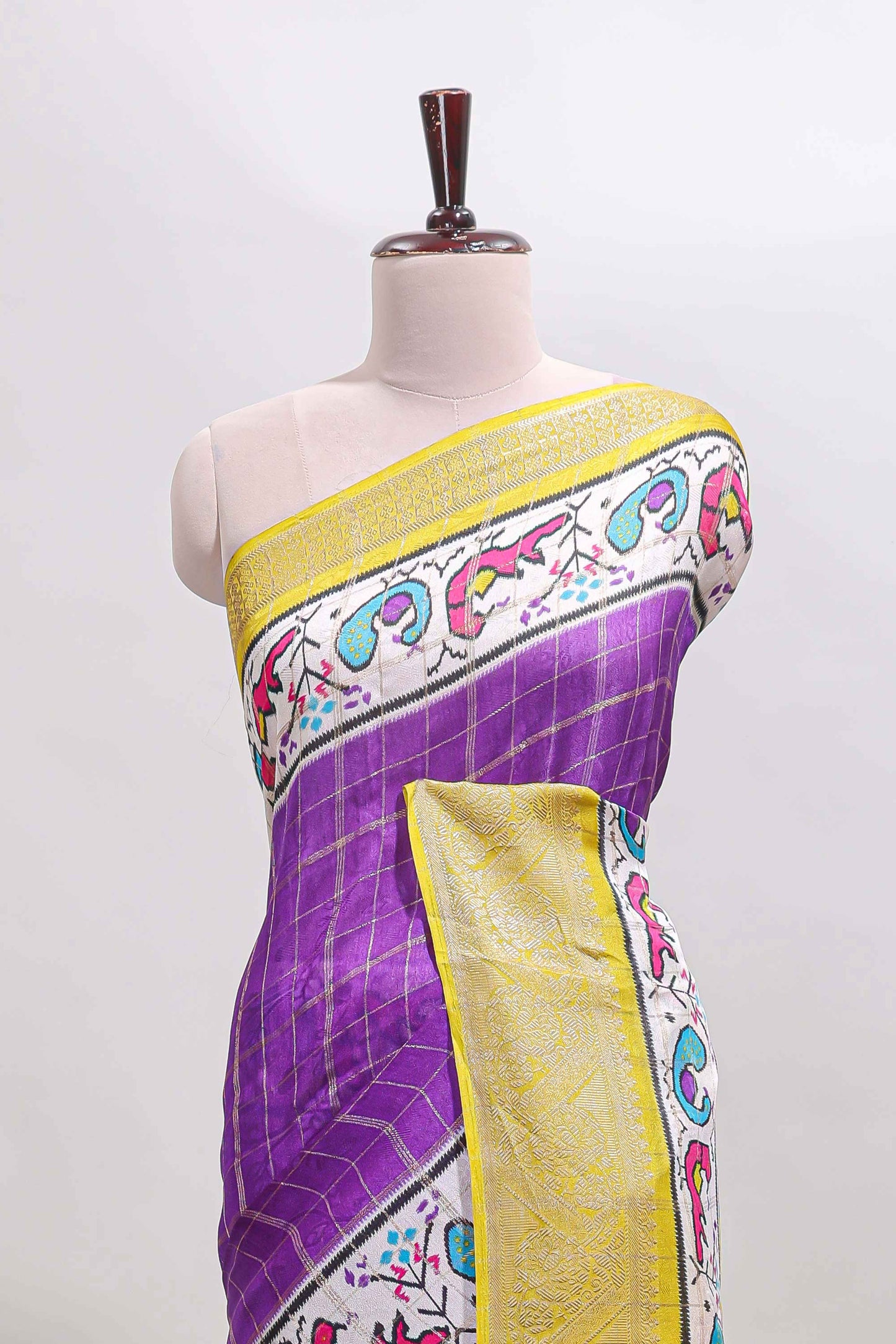 Violet checked dola silk saree with contrast zari border and blouse