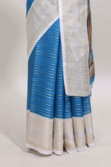 Blue zari striped dola silk saree withcontrast zari border and printed blouse
