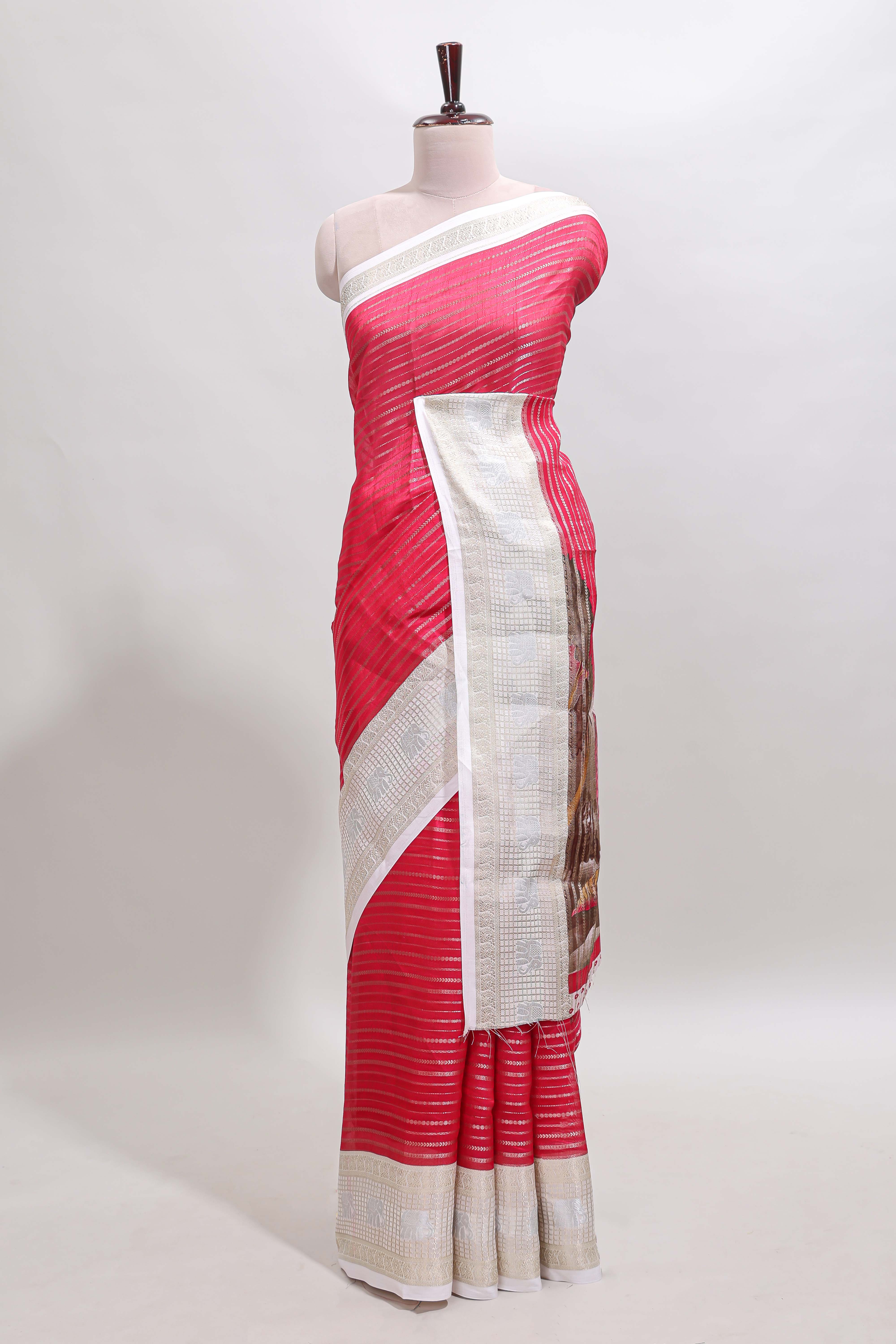 Pink zari striped dola silk saree withcontrast zari border and printed blouse