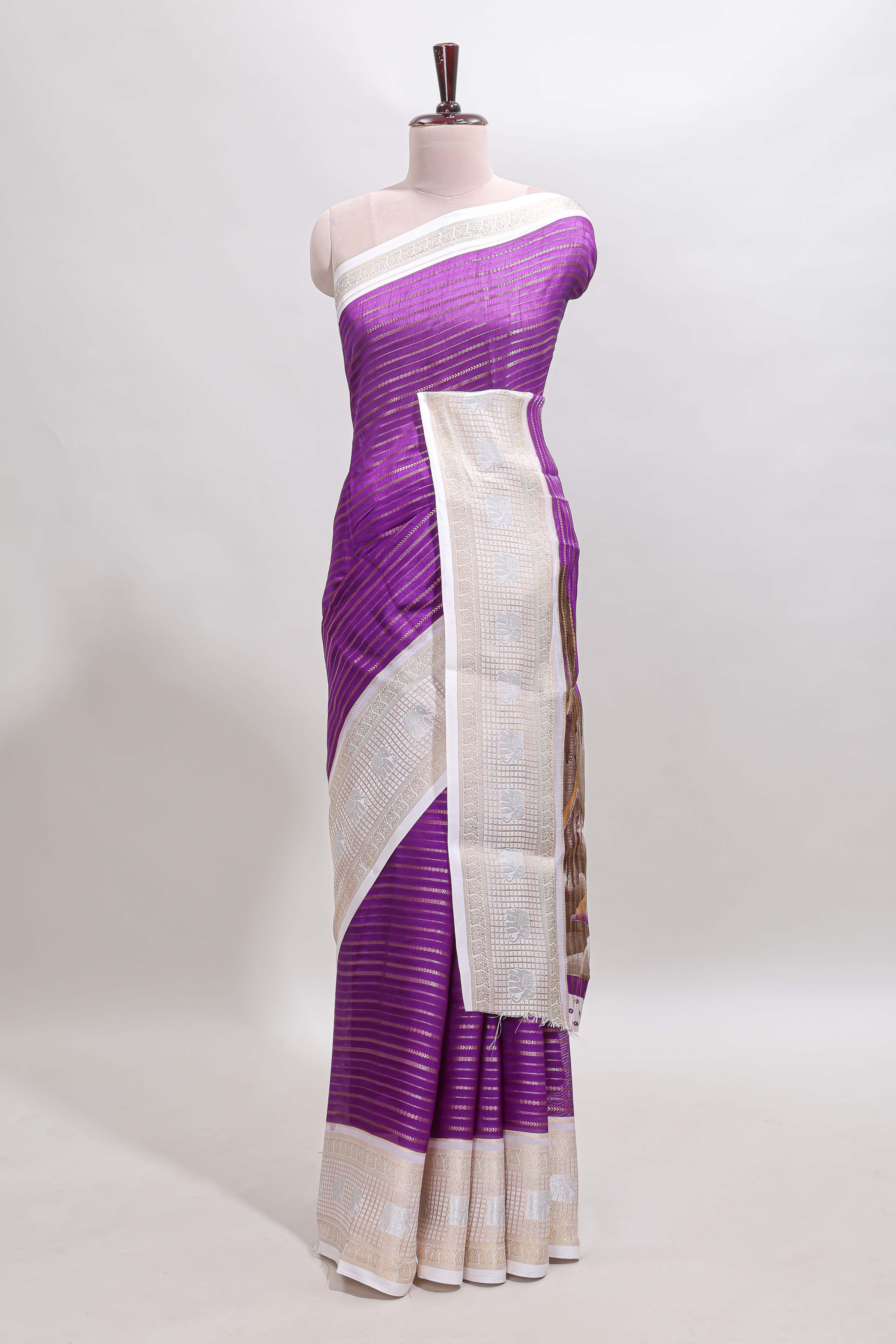 Violet zari striped dola silk saree withcontrast zari border and printed blouse