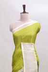 Green zari striped dola silk saree withcontrast zari border and printed blouse