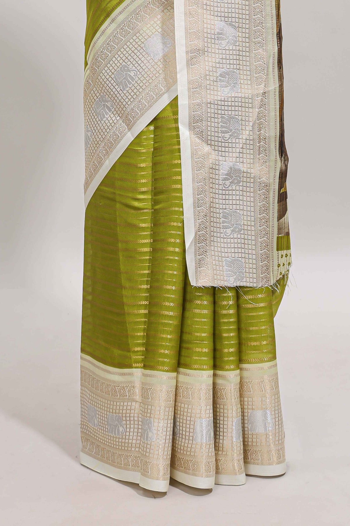 Green zari striped dola silk saree with  contrast zari border and printed blouse