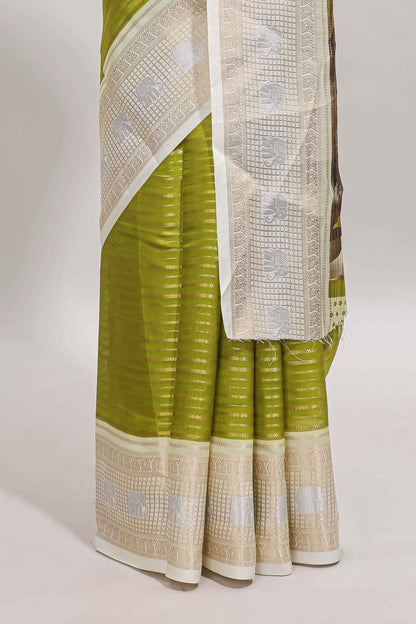 Green zari striped dola silk saree with  contrast zari border and printed blouse