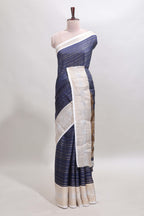 Dark blue zari striped dola silk saree with  contrast zari border and printed blouse