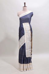 Dark blue zari striped dola silk saree withcontrast zari border and printed blouse