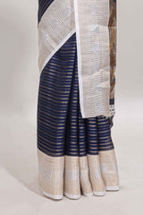 Dark blue zari striped dola silk saree withcontrast zari border and printed blouse