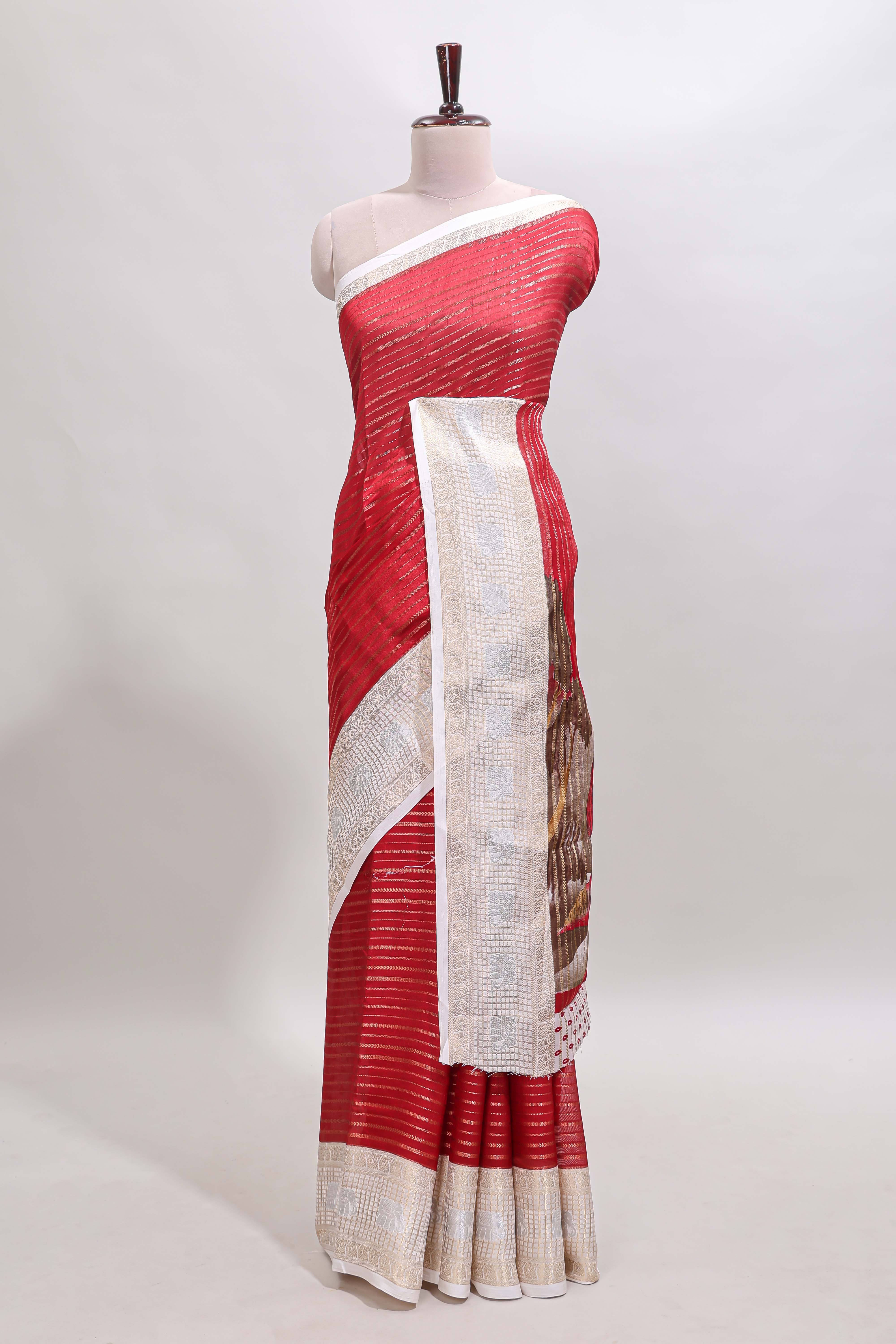 Red zari striped dola silk saree withcontrast zari border and printed blouse