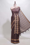 Brown checked dola silk saree with self zari border and matching striped pallu