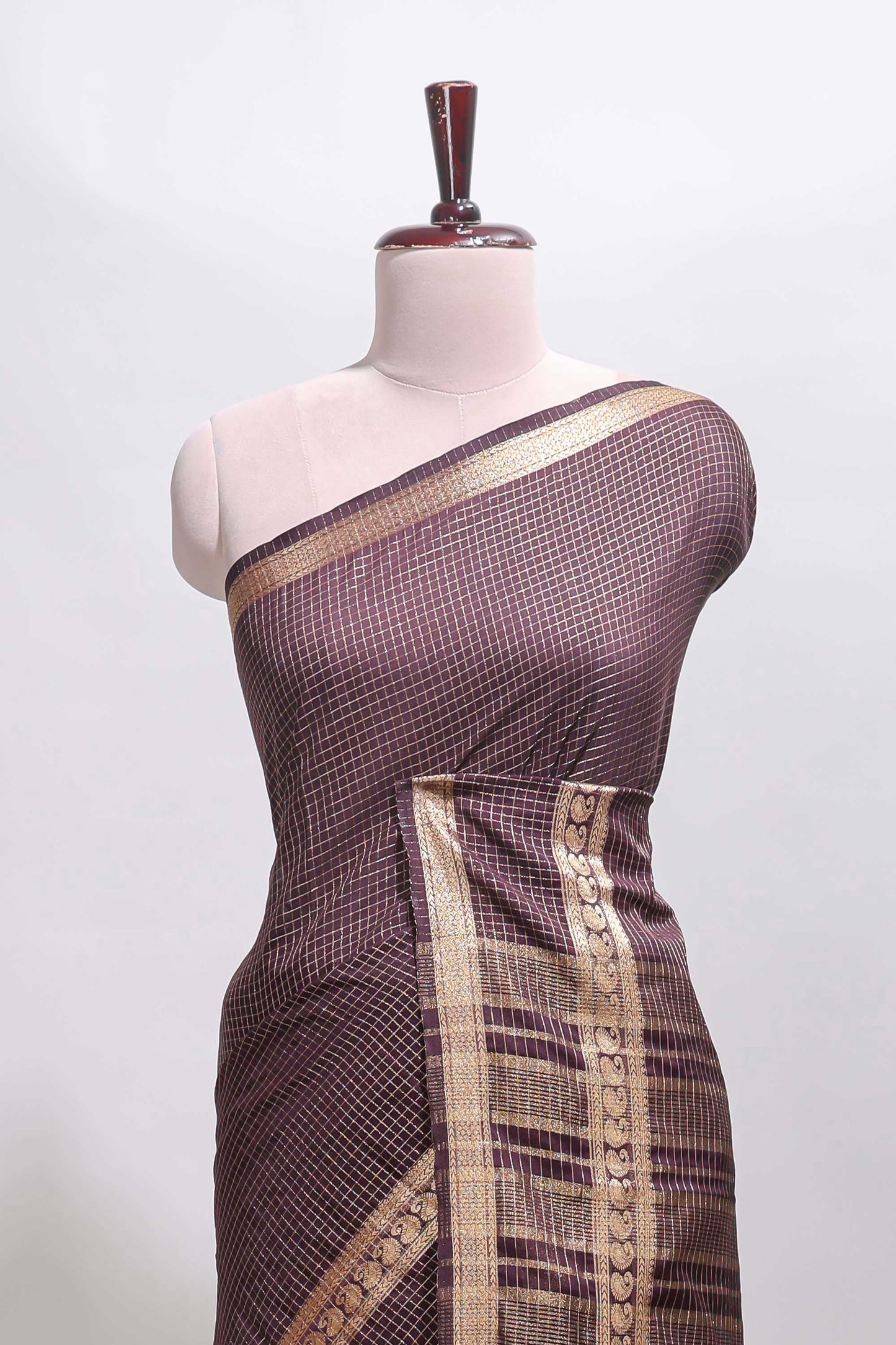 Brown checked dola silk saree with self zari border and matching striped pallu