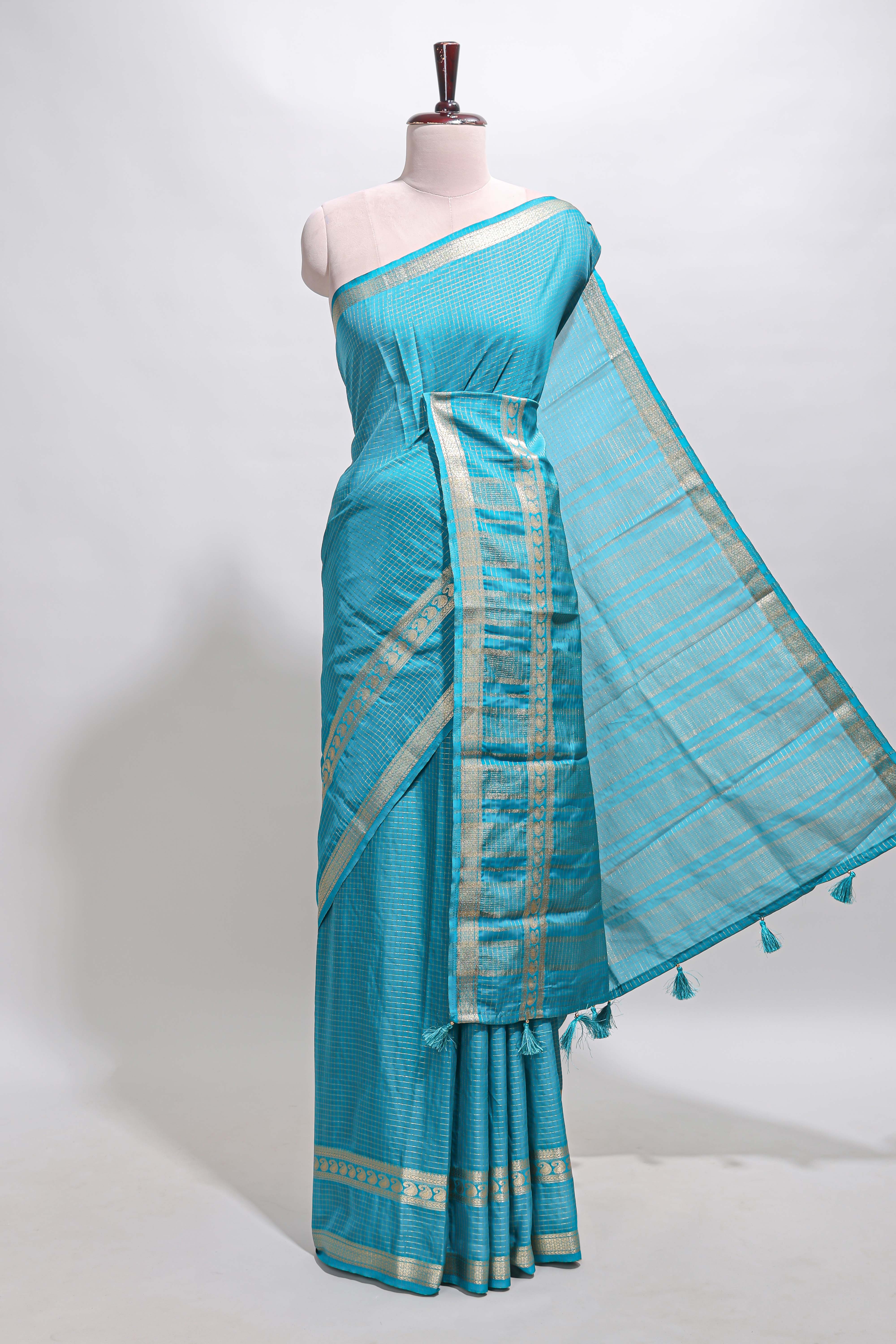 Blue checked dola silk saree with self zari border and matching striped pallu