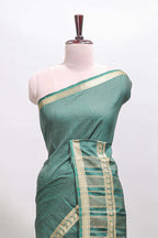 Green checked dola silk saree with self zari border and matching striped pallu