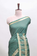 Green checked dola silk saree with self zari border and matching striped pallu