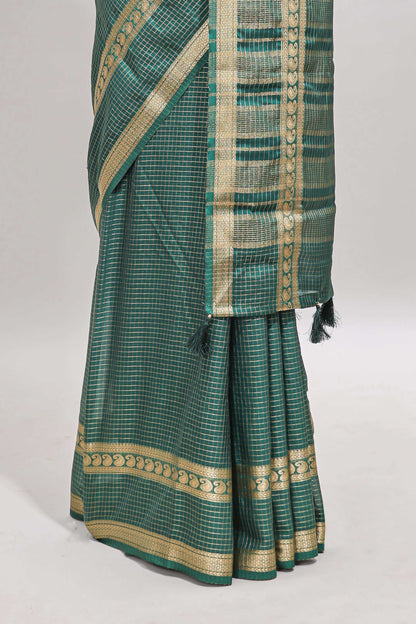 Green checked dola silk saree with self zari border and matching striped pallu