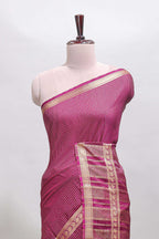 Magenta checked dola silk saree with self zari border and matching striped pallu