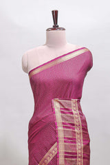 Magenta checked dola silk saree with self zari border and matching striped pallu