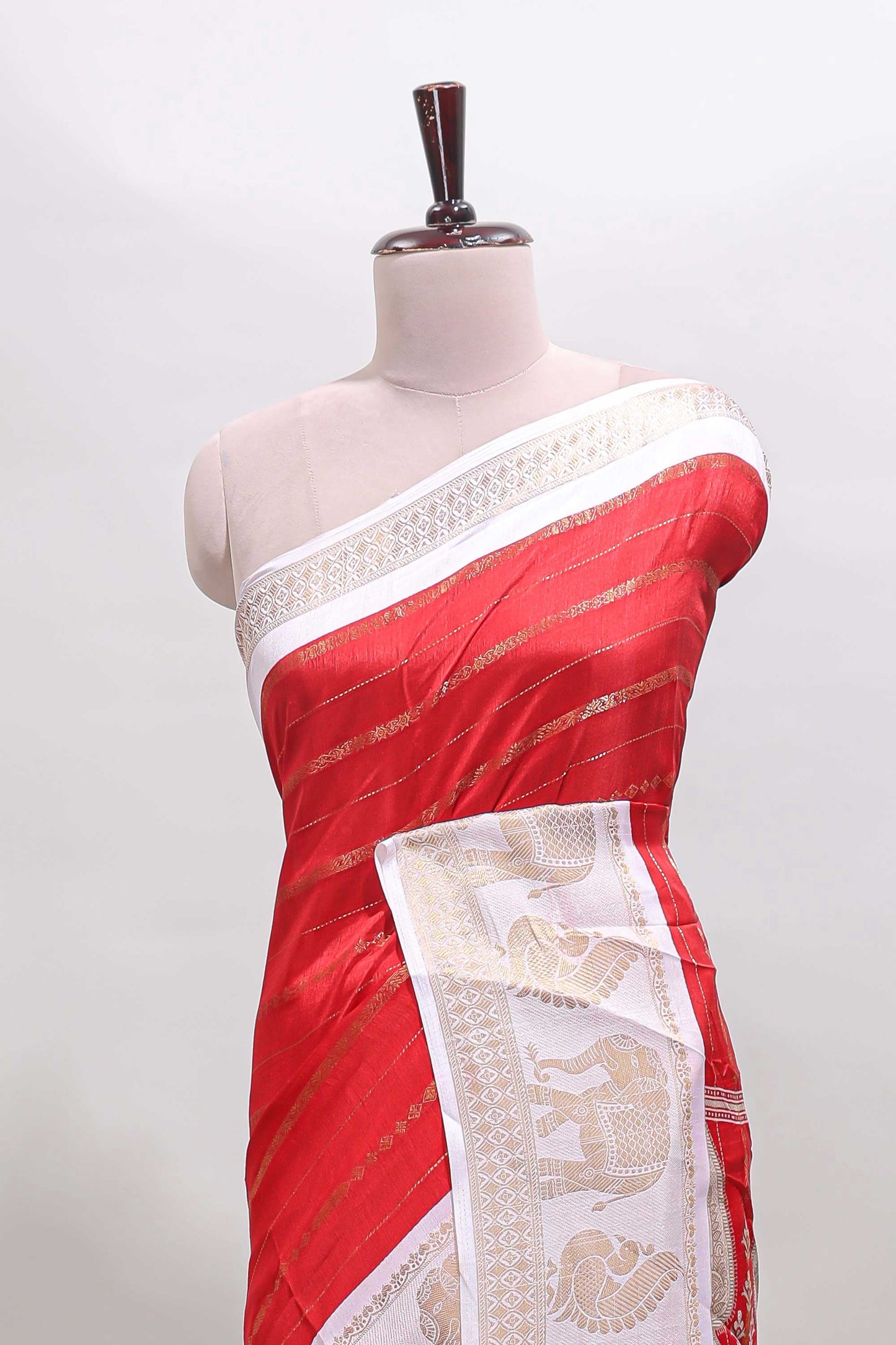 Red striped dola silk saree with contrast zari border and kalamkari style pallu
