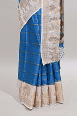 Peacock blue striped dola silk saree with contrast zari border and kalamkari style pallu