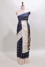 Dark blue striped dola silk saree with contrast zari border and kalamkari style pallu