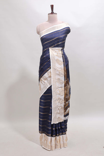 Dark blue striped dola silk saree with contrast zari border and kalamkari style pallu