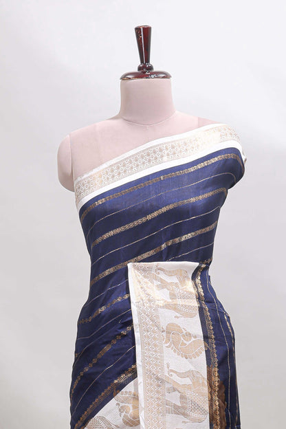 Dark blue striped dola silk saree with contrast zari border and kalamkari style pallu