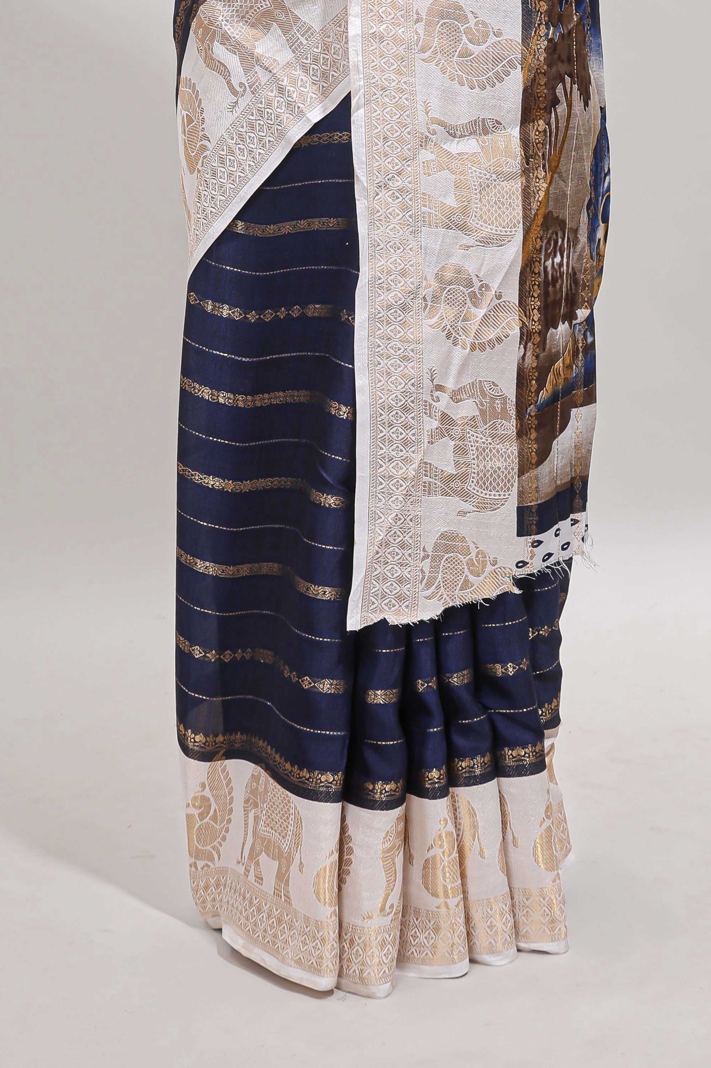 Dark blue striped dola silk saree with contrast zari border and kalamkari style pallu