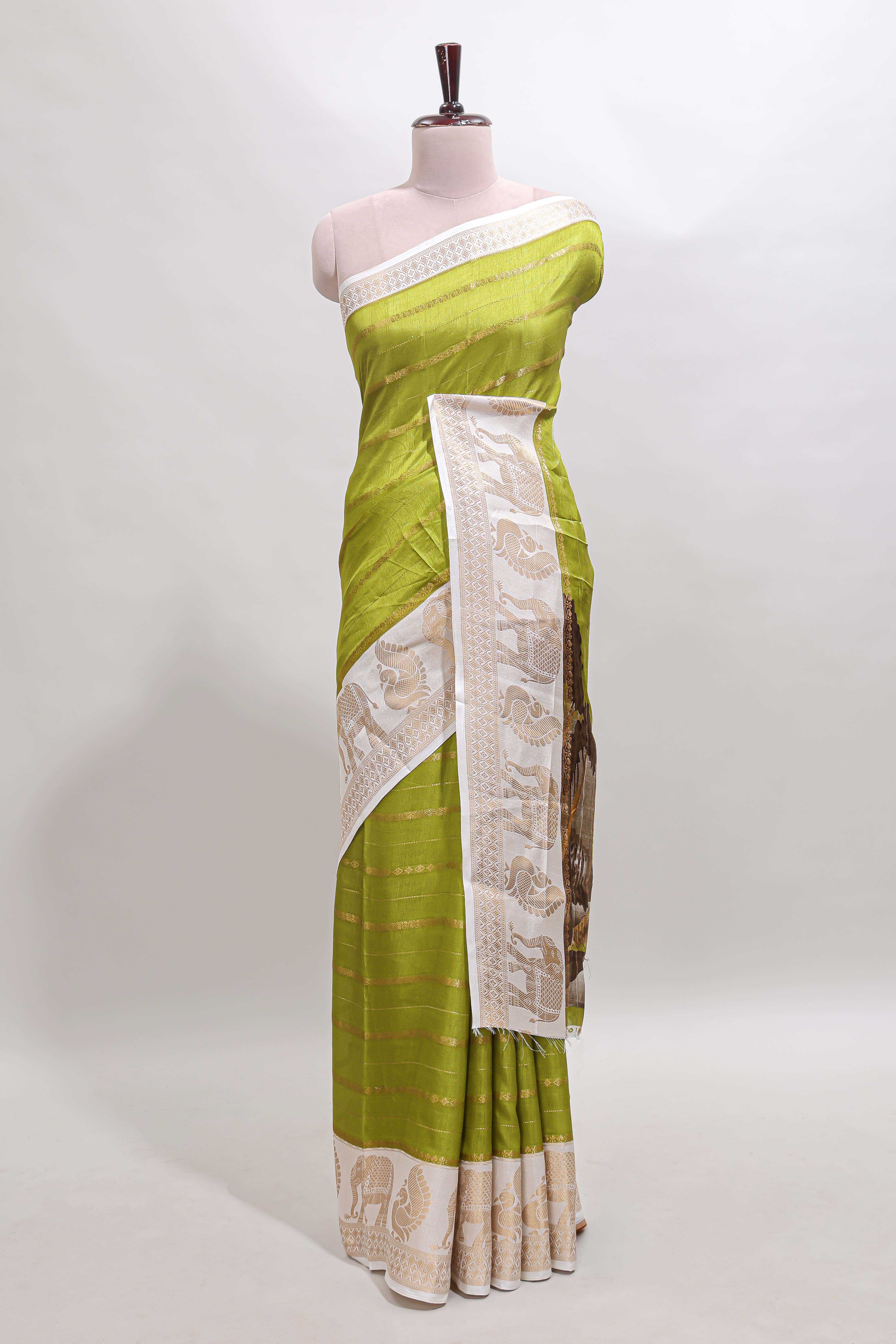Green striped dola silk saree with contrast zari border and kalamkari style pallu