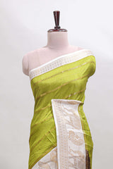 Green striped dola silk saree with contrast zari border and kalamkari style pallu