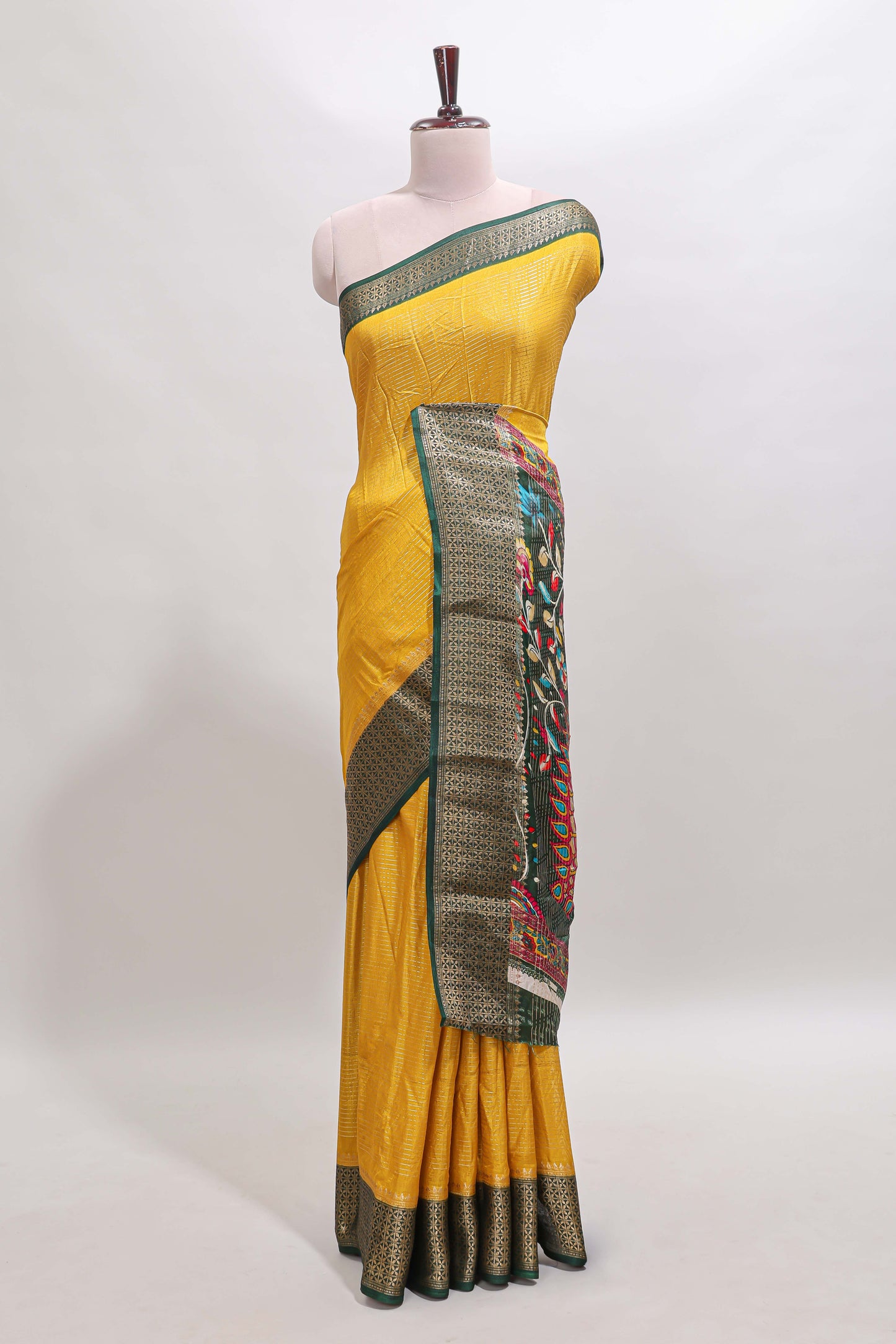 Mustard striped dola silk saree with contrast zari border and peacock & floral design pallu