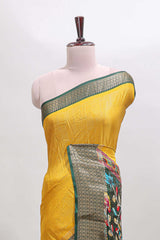 Mustard striped dola silk saree with contrast zari border and peacock & floral design pallu