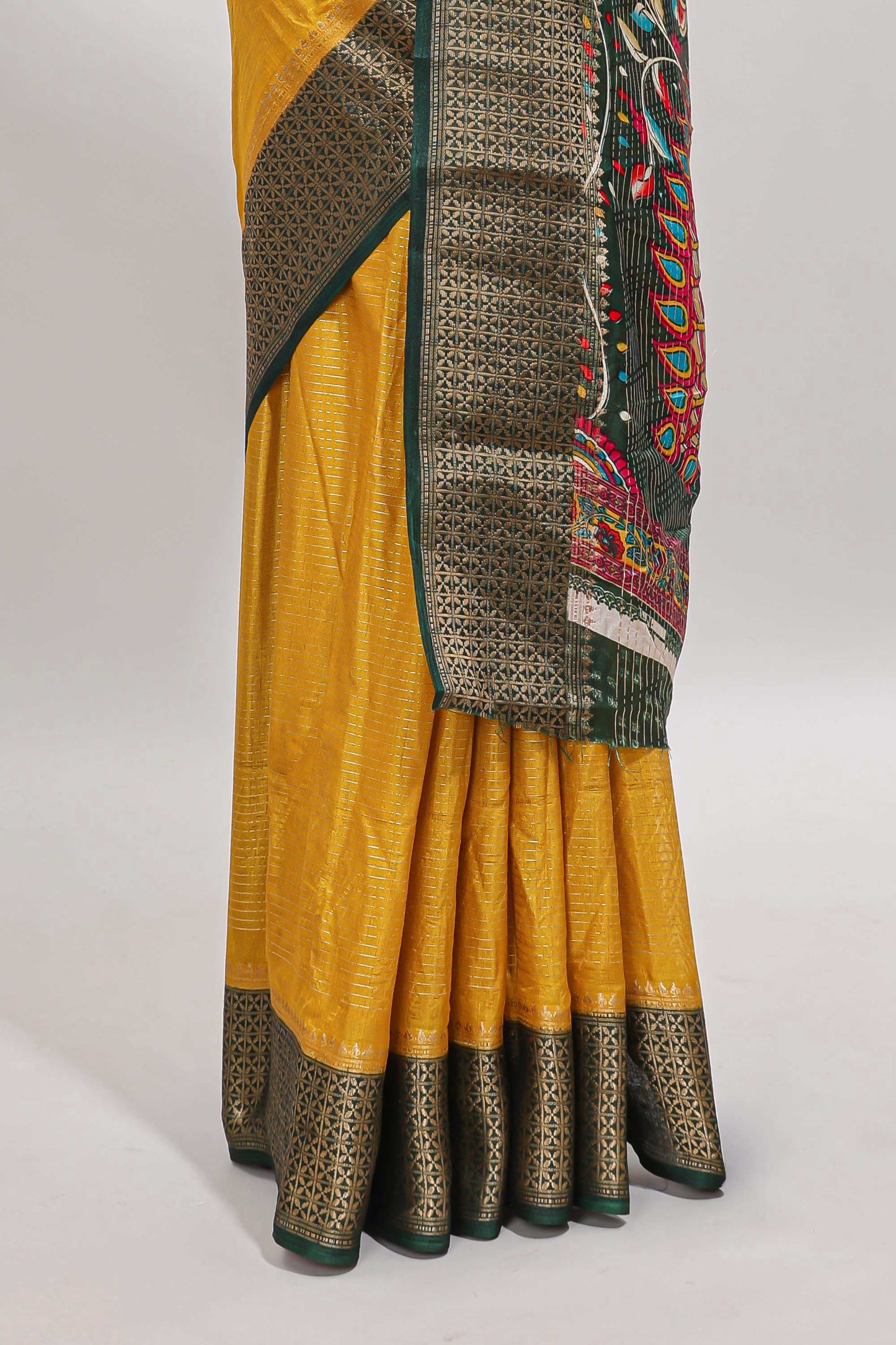 Mustard striped dola silk saree with contrast zari border and peacock & floral design pallu