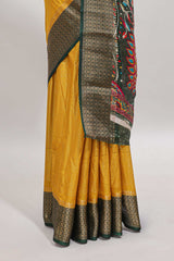 Mustard striped dola silk saree with contrast zari border and peacock & floral design pallu