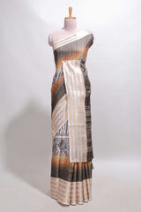 Grey geometric design dola silk saree withcontrast zari border and matching blouse