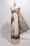 Grey geometric design dola silk saree withcontrast zari border and matching blouse
