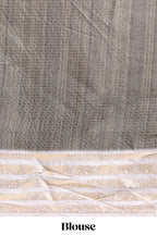 Grey geometric design dola silk saree with  contrast zari border and matching blouse