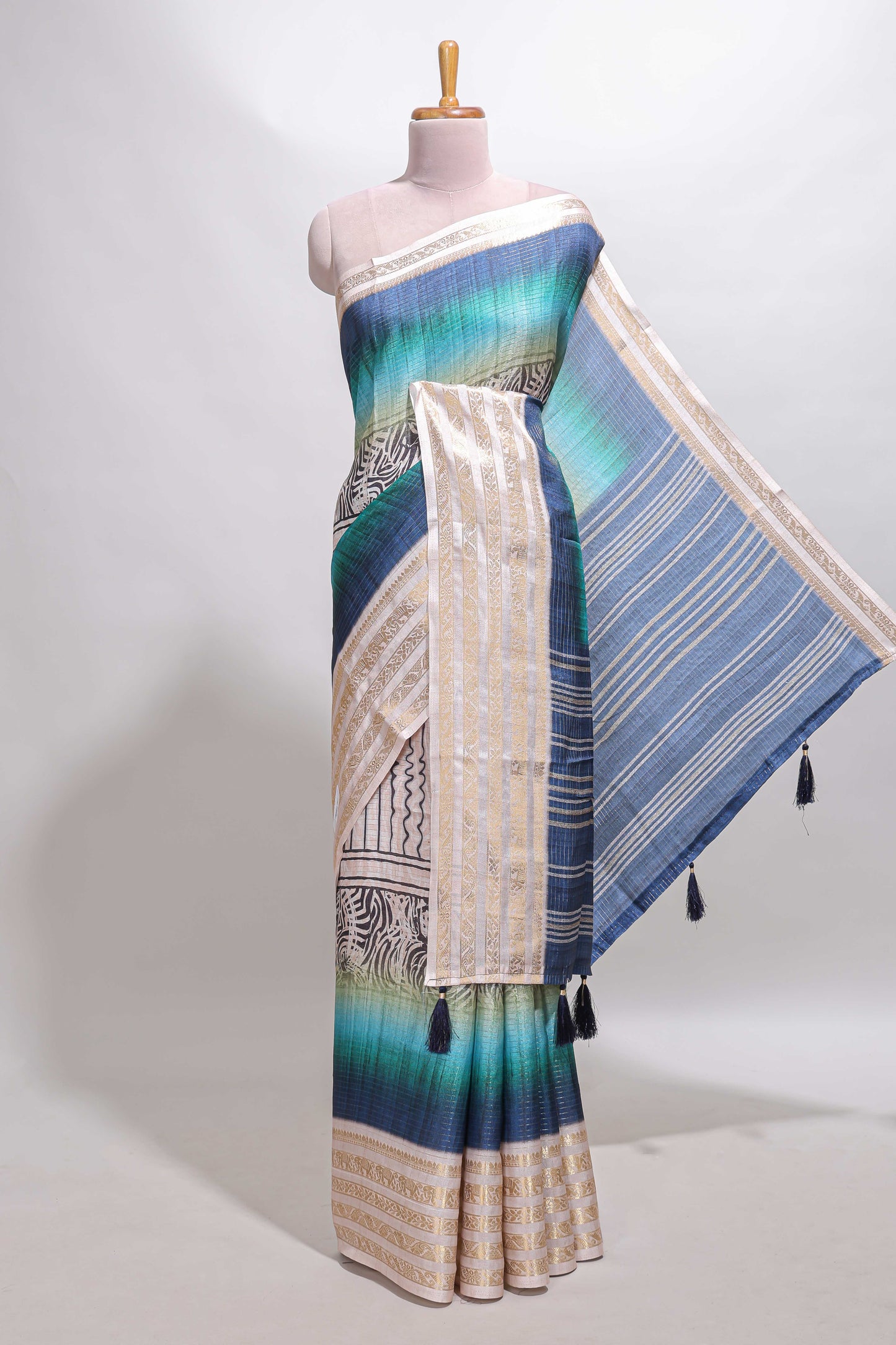 Blue geometric design dola silk saree with contrast zari border and matching blouse