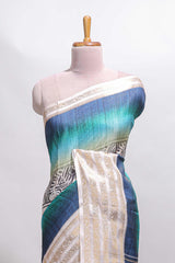 Blue geometric design dola silk saree with contrast zari border and matching blouse