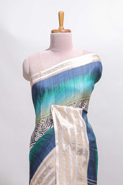 Blue geometric design dola silk saree with contrast zari border and matching blouse