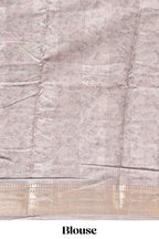 Brown floral design dola silk saree with sellf zari border and matching blouse