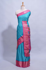 Turquoise blue dola silk saree with fine zari stripes contrastzari border and a rich peacock floral woven pallu along with printed contrast blouse
