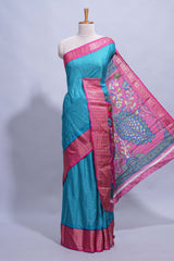 Turquoise blue dola silk saree with fine zari stripes contrastzari border and a rich peacock floral woven pallu along with printed contrast blouse