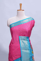 Pink dola silk saree with fine zari stripes contrastzari border and a rich peacock floral woven pallu along with printed contrast blouse